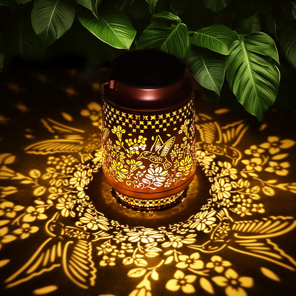 Fussion hummingbird solar lantern glowing outdoors to create cozy garden evenings
