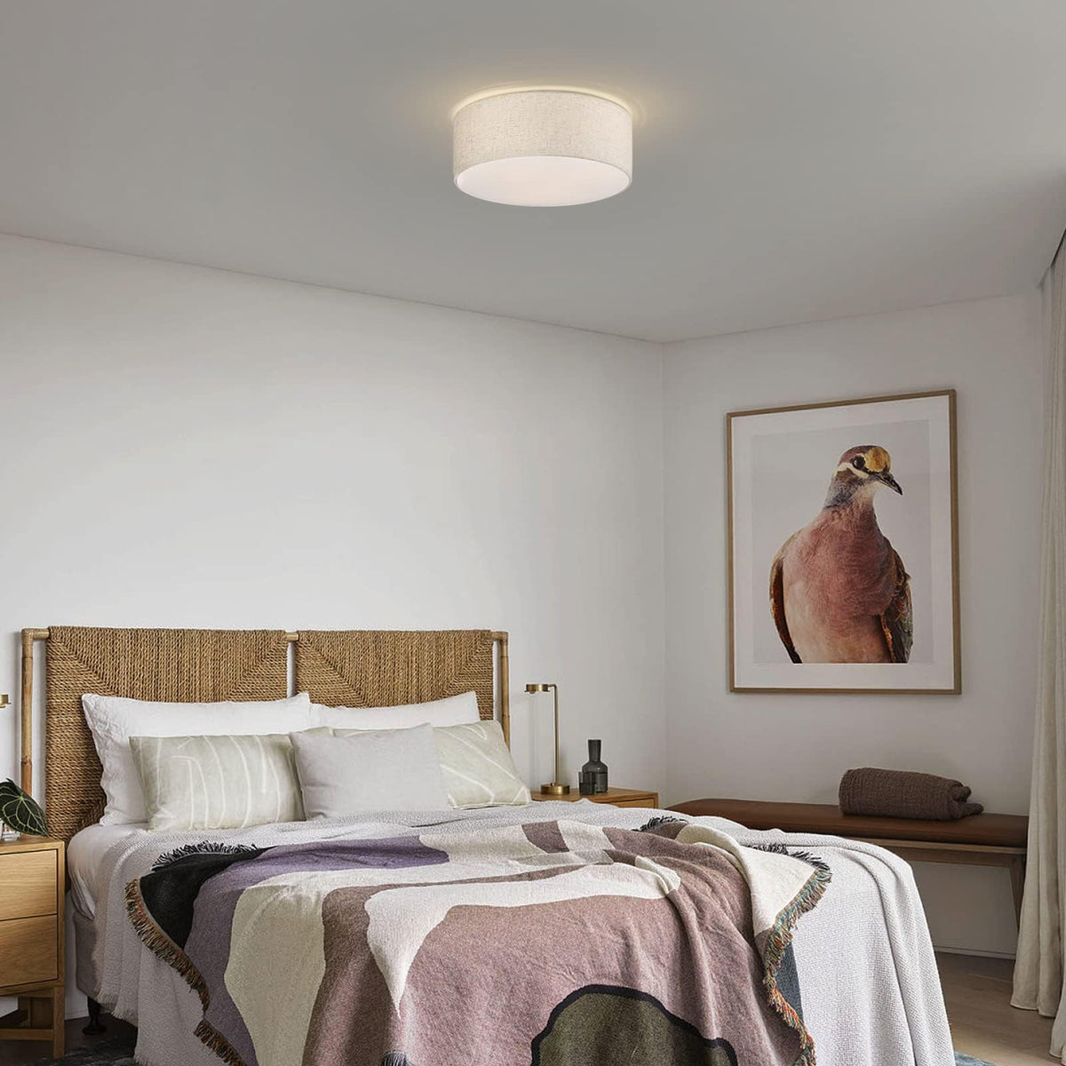 Galtlap linen shade 3 light fixture creates warm ambience above dining tables.