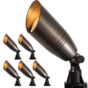 Gardencoin solid brass spotlight illuminates the front entry for welcoming evenings