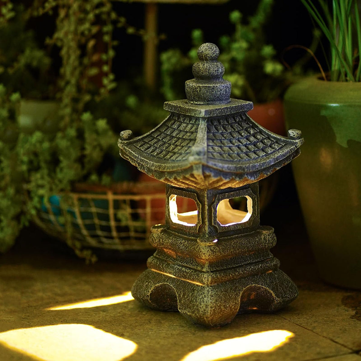Gardenfans Solar Pagoda Lantern on patio enhancing outdoor ambience