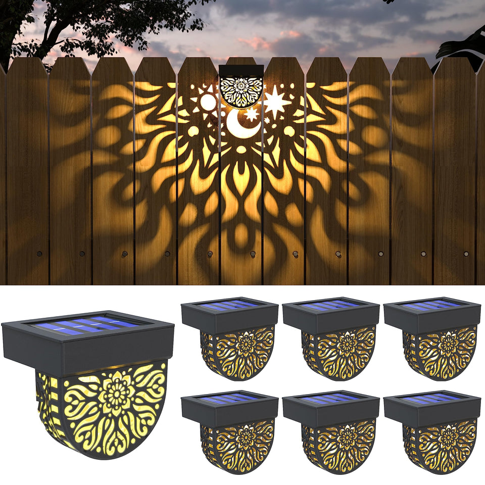 Gardsee solar fence lights cast warm yellow glow along the fence line.