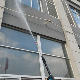 GDHXW in-use pressure washer attachment delivering powerful outdoor cleaning