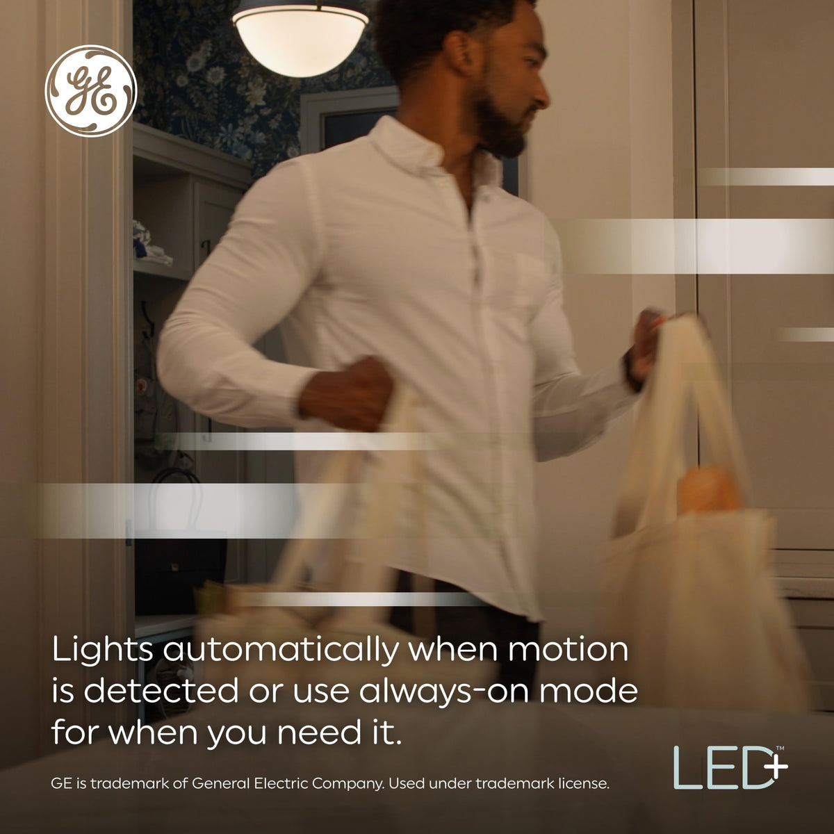 GE LED+ motion sensor light bulb night illumination highlighting security in darkness
