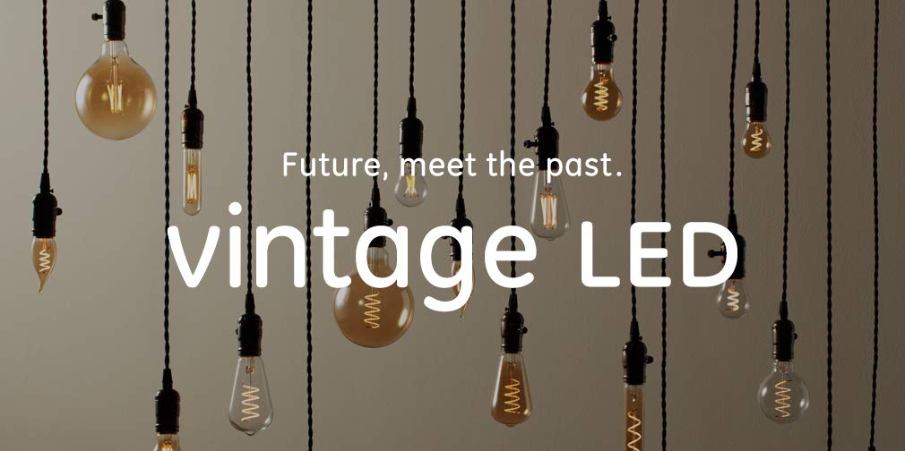 GE Vintage LED amber glass A19 bulb in a chandelier application with warm glow.