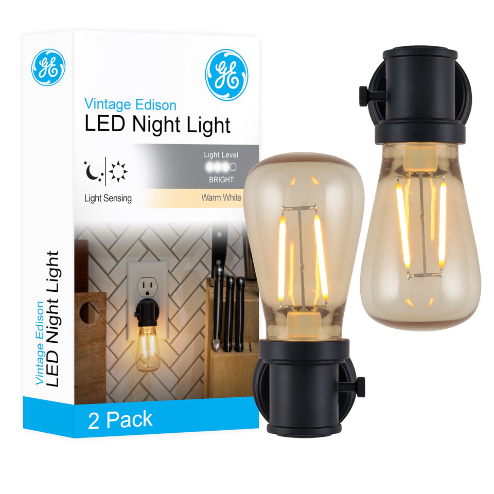 GE vintage Edison night light plugged into outlet for subtle hallway ambiance