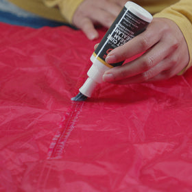 GEAR AID Seam Grip FC applied on nylon fabric during sealing process