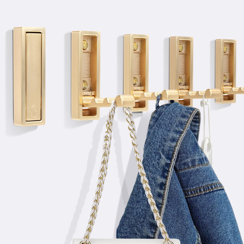 Generic 5pcs foldable gold wall hooks in bathroom for space-saving organization.