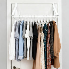 Generic Over The Door Hanger Rack supports clothes and towels on sturdy hooks.