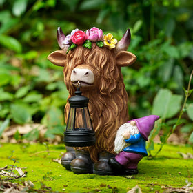 Generic TOLIMI resin statue with solar lighting for evening ambiance.