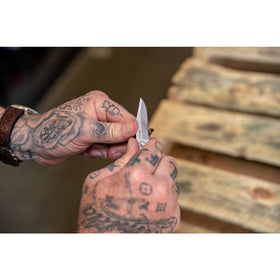 Handle cutouts reduce weight while maintaining strength on the Gerber Paraframe Mini.
