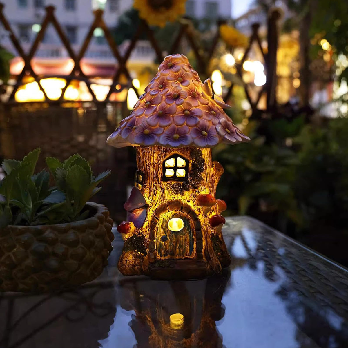 GEYUEYA Home fairy garden house with outdoor light illuminates your backyard evenings.