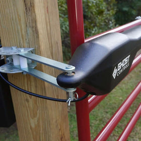 Close-up of Ghost Controls AXPO gate opener installation with brackets.