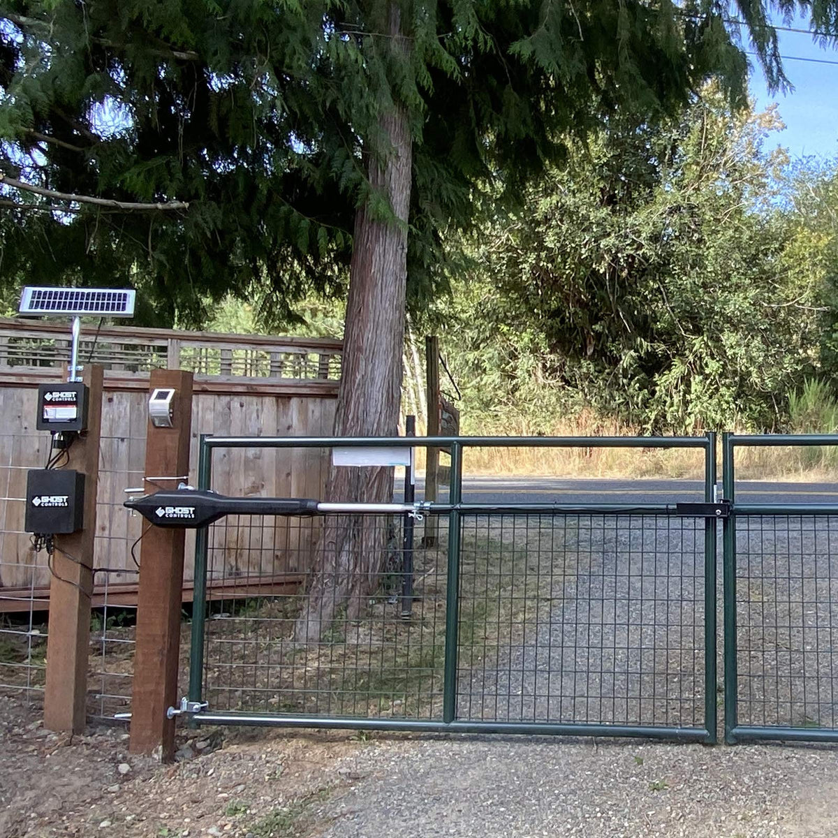 Ghost Controls TDS2XP dual-arm assembly mounted on a gate