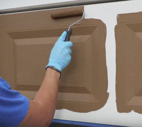 Giani plastic tarps protect surrounding surfaces during outdoor door makeover.