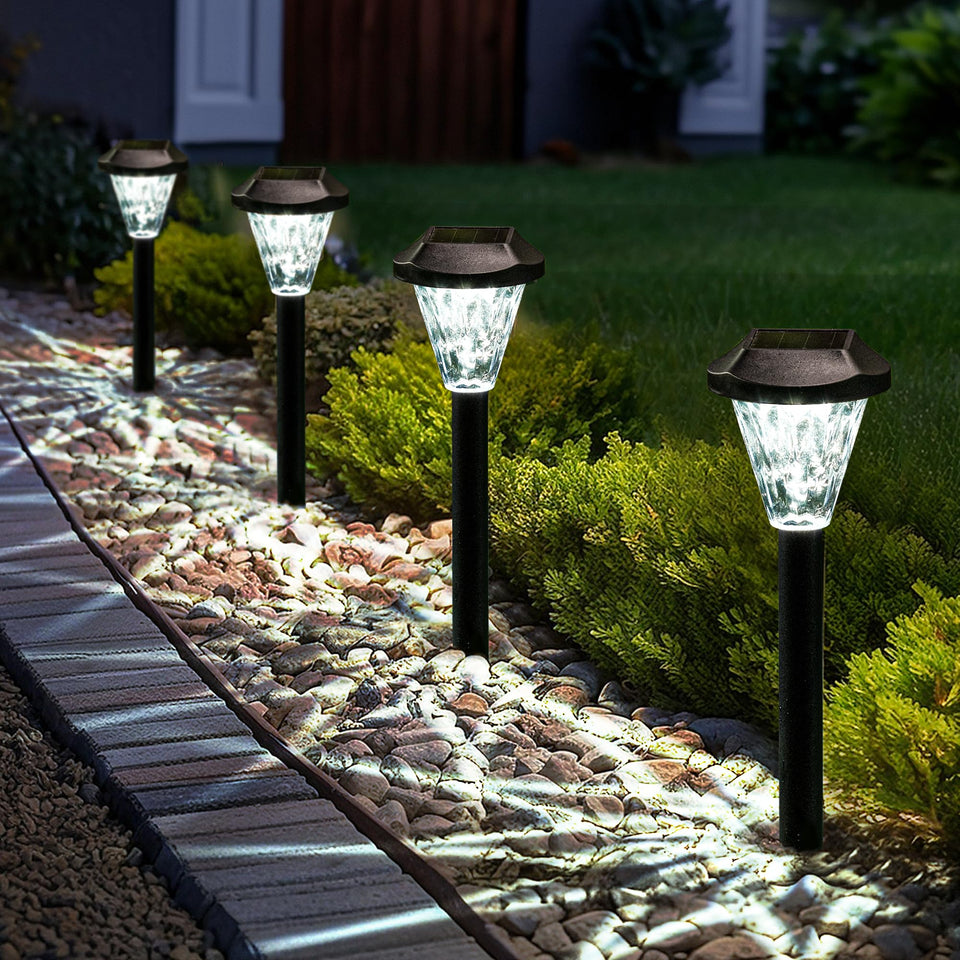 GIGALUMI solar lights along a path casting a starry pattern at dusk