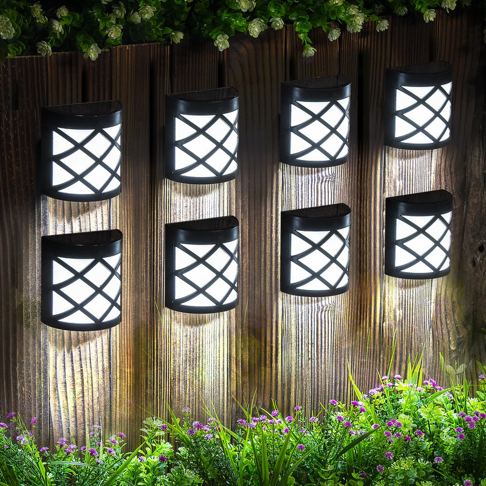 GIGALUMI 8-pack solar fence lights front-door glow for safer entry.