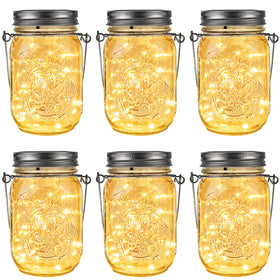 GIGALUMI hanging mason jar solar lights illuminating an outdoor patio at dusk