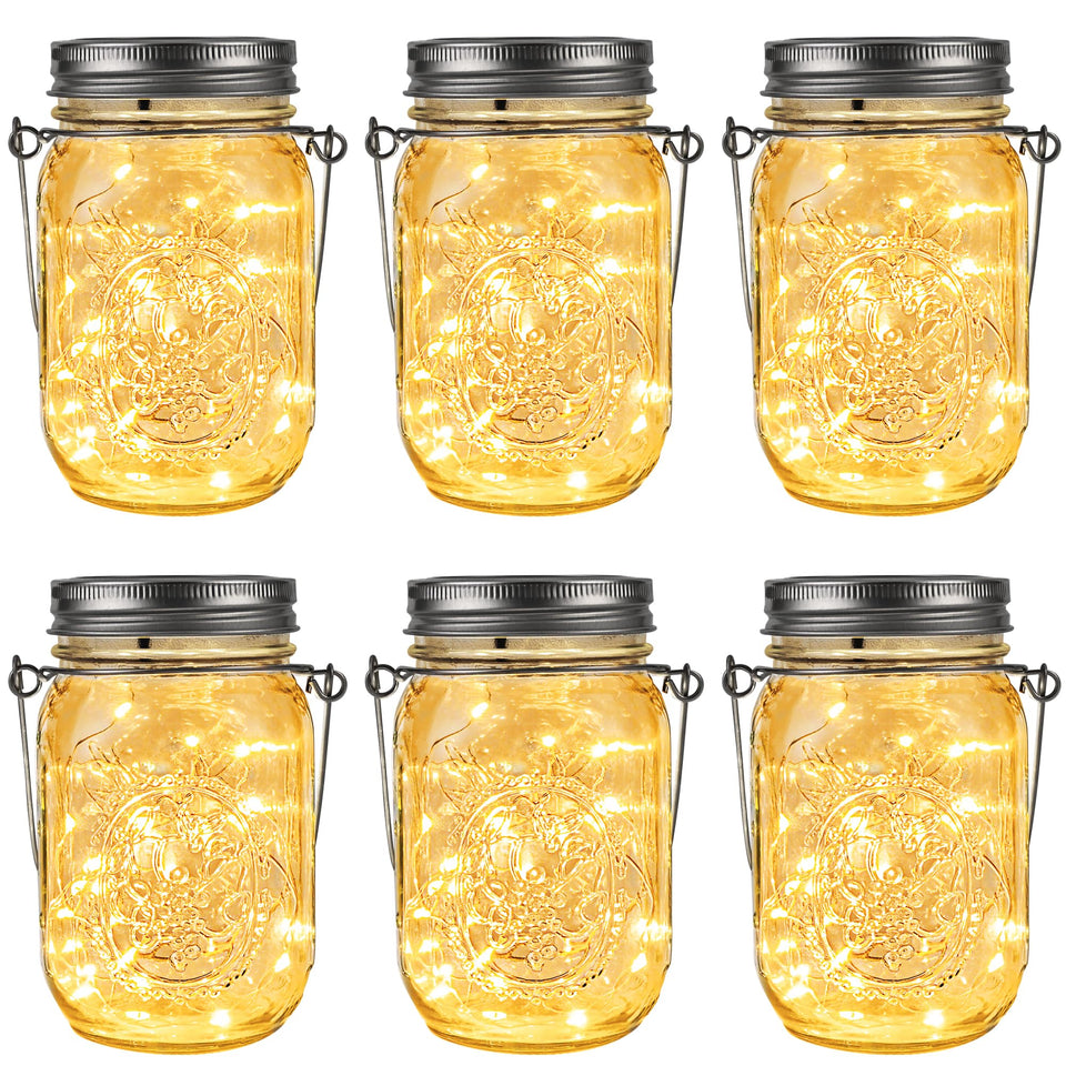 GIGALUMI hanging mason jar solar lights illuminating an outdoor patio at dusk