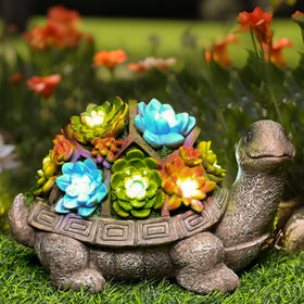 GIGALUMI solar garden turtle statue glows at dusk for outdoor ambiance.