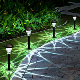 GIGALUMI solar light with star pattern illuminates pathways with a magical glow
