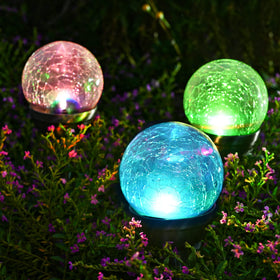 GIGALUMI cracked glass ball light producing ambient glow for outdoor decor