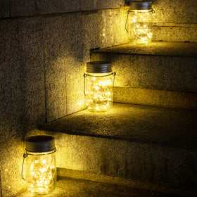 GIGALUMI solar-powered jar lights charge by day and glow at night.