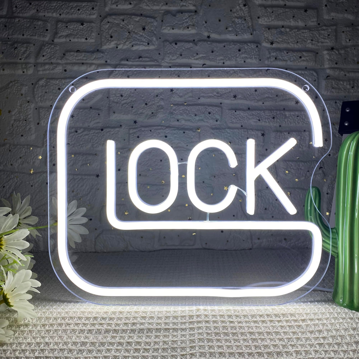 Gippro Lock neon sign on wall adds vibrant ambiance for game room.