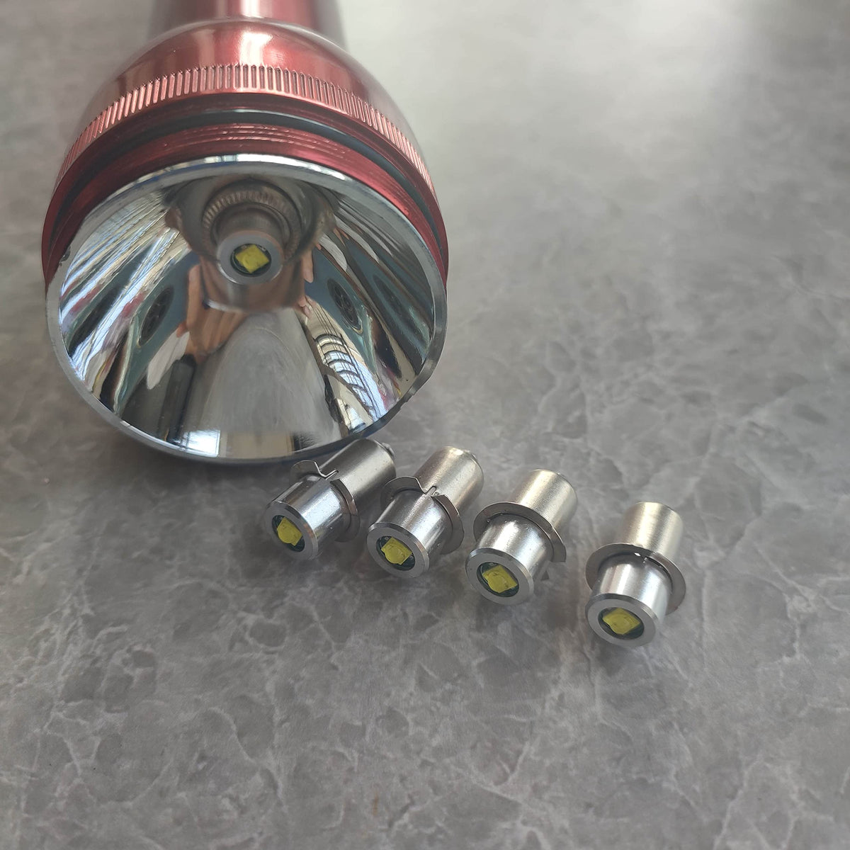 GLGYCB P13.5S PR2 LED bulb pack side view, reliable upgrade for C&D cell flashlights.