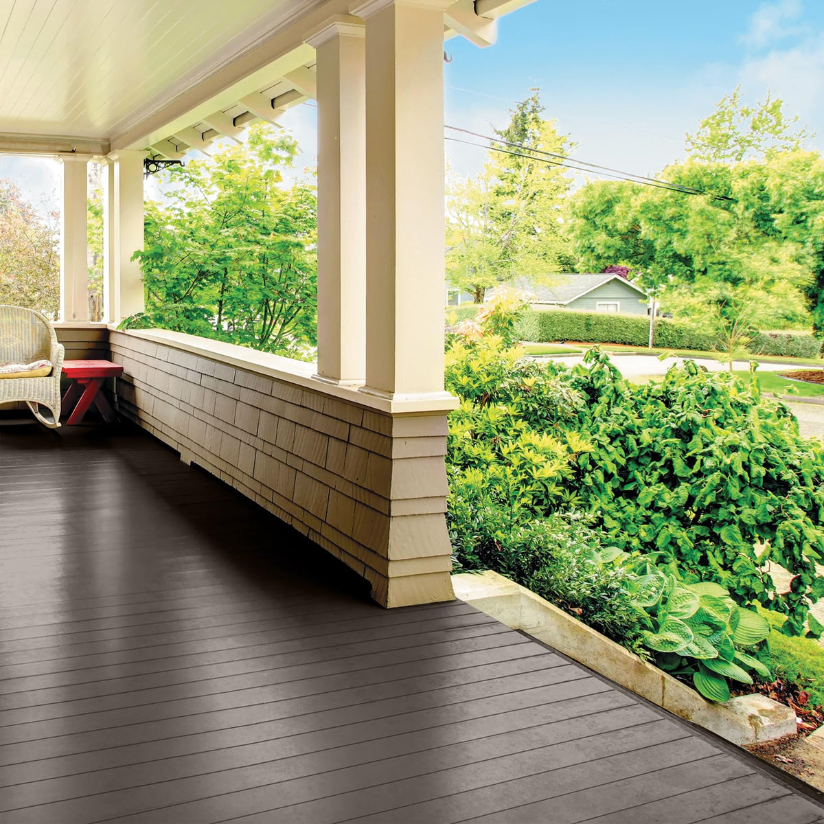 Glidden Grab-N-Go brush-stroke on brown surface shows easy coverage.