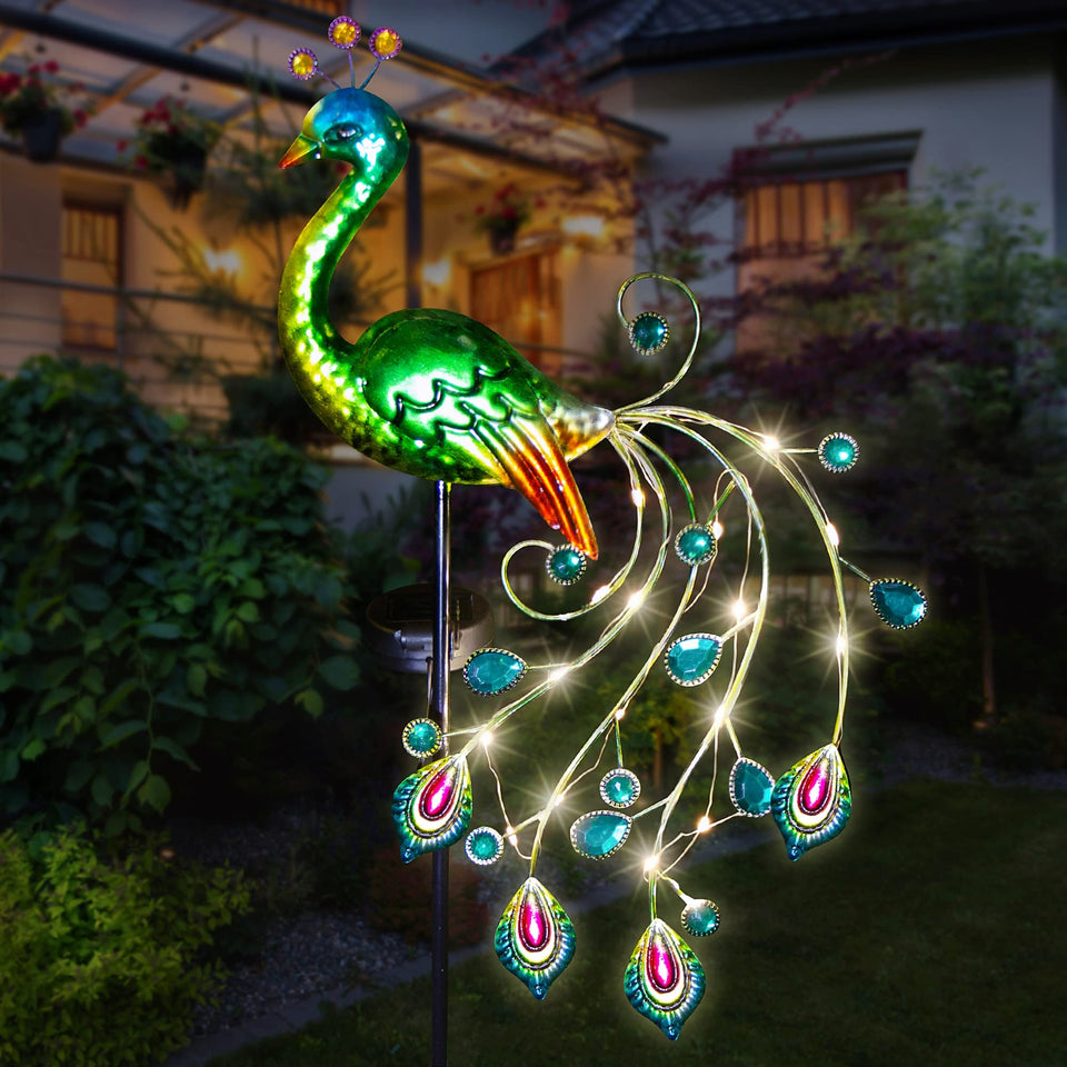 Glintoper solar garden peacock stake stands 39 inches tall and lights your yard at dusk.
