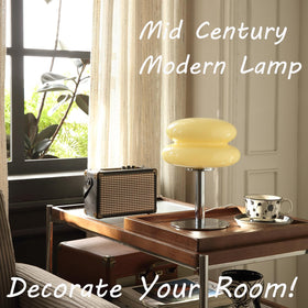 Glivpny lamp features a silver metal pole and hand-blown glass shade for chic decor.