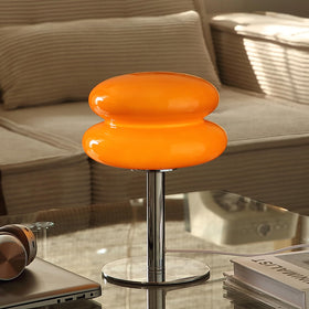Glivpny table lamp with silver pole for a sleek modern look