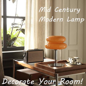 Glivpny table lamp with silver pole adds a modern desk lighting touch.