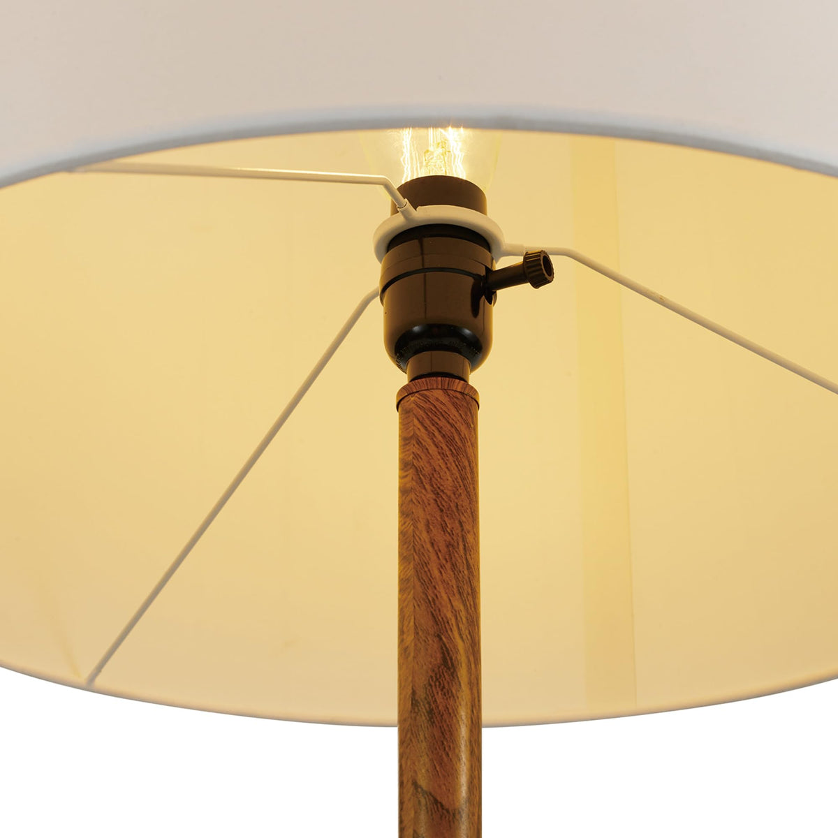 Harrington lamp placed in a bedroom corner for calm illumination