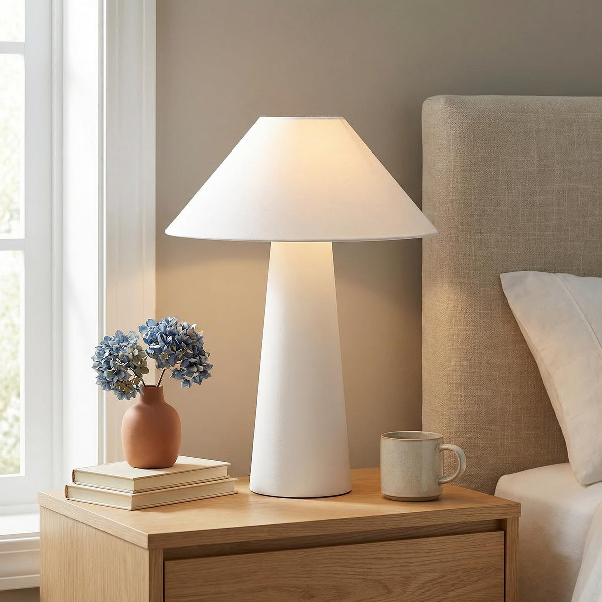 Globe Electric Novogratz off-white tapered fabric shade diffuses light softly.