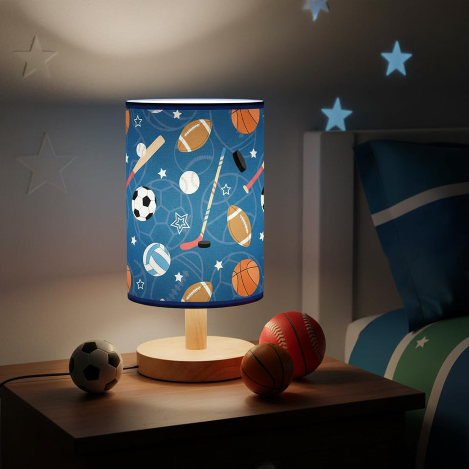 Glooglitter sports ball table lamp, front view, adds playful sports style to kids' rooms.