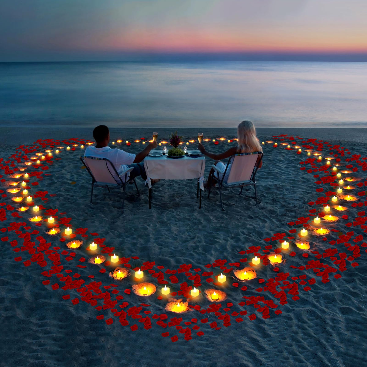 Gobutend wedding table centerpiece with petals and glowing hearts