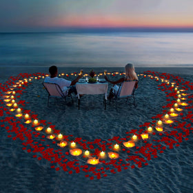 Gobutend wedding table centerpiece with petals and glowing hearts