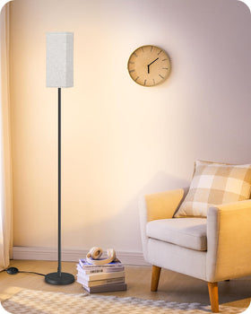 GOEBLESON floor lamp beige shade enhances warm living room ambience.