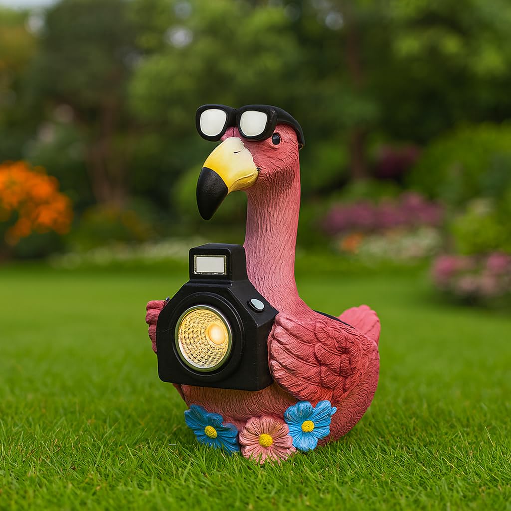 GoGnome solar flamingo camera-light glows in garden at dusk