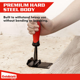 Goldblatt Trim Removal Tool in use on flooring highlights efficient baseboard separation.
