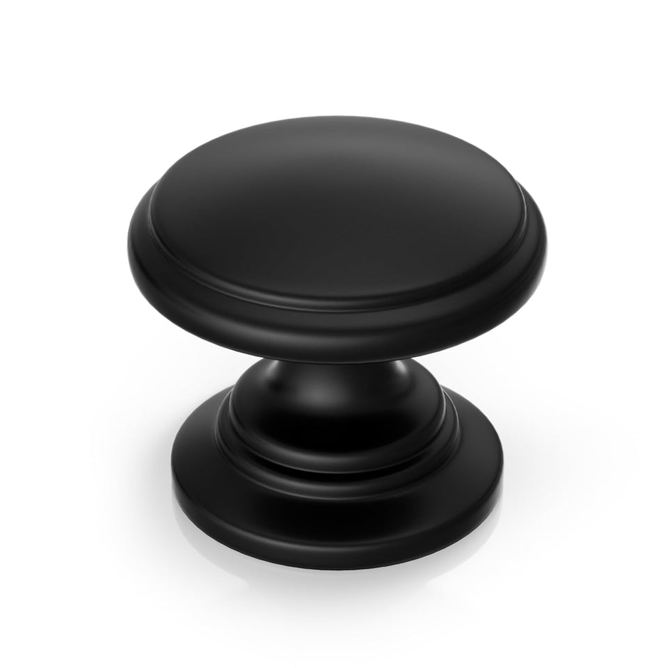Goldenwarm black round cabinet knob with smooth zinc alloy finish for modern cabinetry.