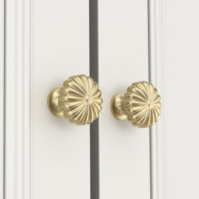 Goldenwarm gold drawer knob on wood surface adds a luxe touch