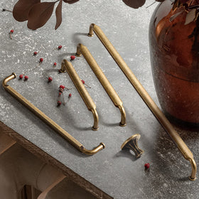 Goo-Ki zinc alloy six-pack drawer handle with antique brass finish.