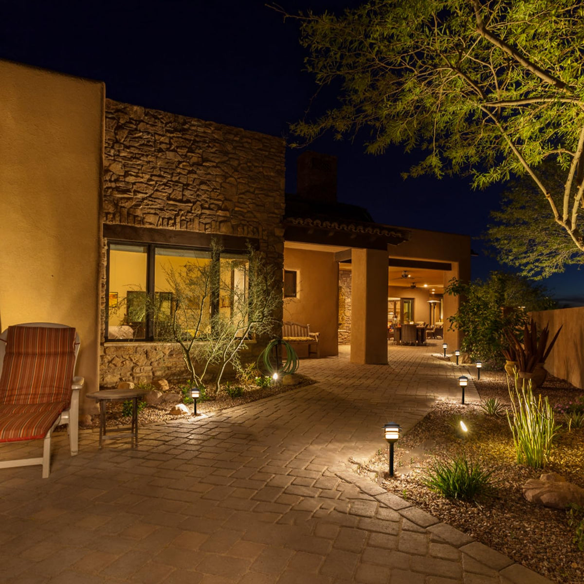 GOODSMANN warm white outdoor light creates inviting nighttime ambiance along walkways.