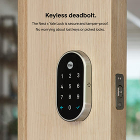 Google Nest x Yale Lock keypad illuminated for easy use in low light conditions.