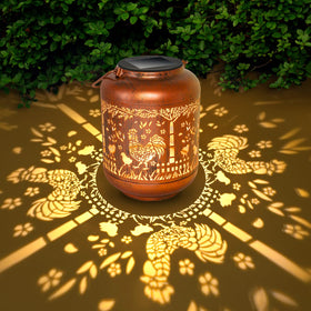 Gotome rooster lantern garden light glows at night for charming ambiance.