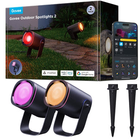Govee Outdoor Spot Lights illuminate a garden path with vivid RGB colors for inviting curb appeal