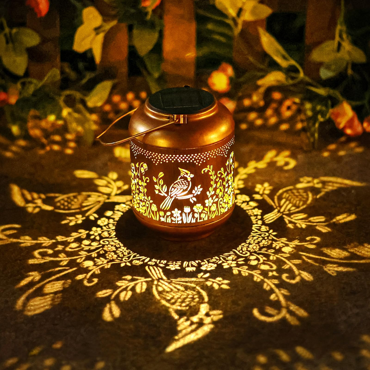 Gr8Gardens Cardinal solar lantern hanging in garden with warm ambient glow.