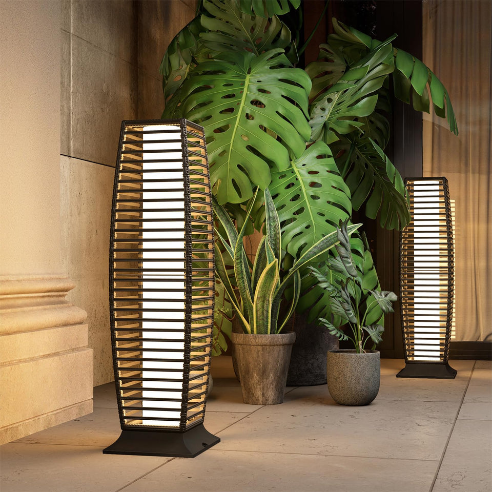 Grand Patio drum-shaped wicker floor lamp provides warm glow for outdoor patios.